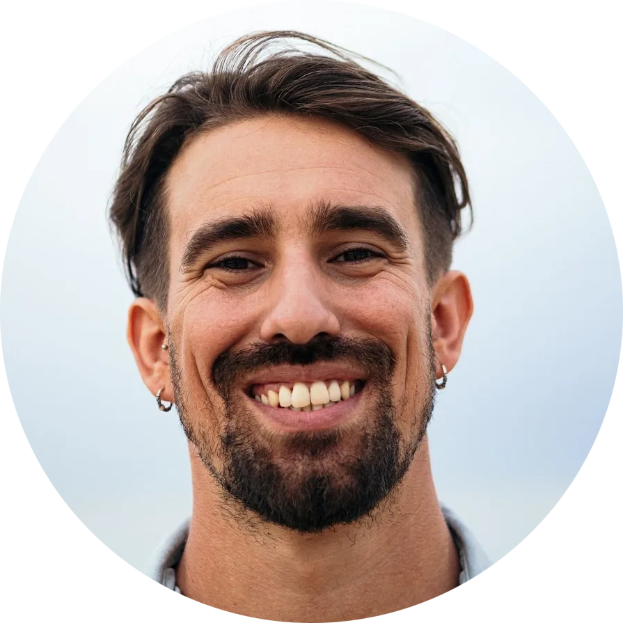 profile shot of young man goatee and earrings